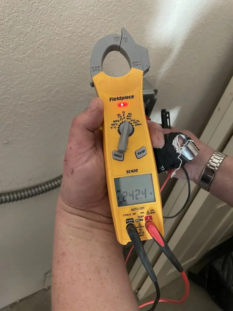 Voltage testing with clamp meter during Aluminum Wiring Replacement in Landmark